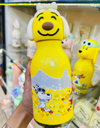 Insulated steel water bottle with 3D puppy silicone cap, close up